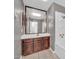 This bathroom features a vanity with storage, a large mirror, and a shower at 6217 W Orange Dr, Glendale, AZ 85301