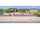 Charming single story home with desert landscaping and a brick and decorative fence at 6217 W Orange Dr, Glendale, AZ 85301