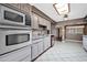 Updated kitchen with stainless steel appliances, neutral cabinets, and granite countertops at 6217 W Orange Dr, Glendale, AZ 85301