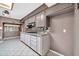 Spacious kitchen featuring gray cabinets, modern appliances, and tile backsplash at 6217 W Orange Dr, Glendale, AZ 85301