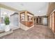 Bright and airy living space featuring large windows, tile flooring, and a unique indoor bar area at 6217 W Orange Dr, Glendale, AZ 85301
