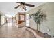 Cozy interior space with tile flooring, a built-in bar area, and decorative plants for a touch of greenery at 6217 W Orange Dr, Glendale, AZ 85301