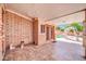 This covered patio has tile floors and an inground pool at 6217 W Orange Dr, Glendale, AZ 85301