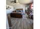 Primary bedroom with ceiling fan, wood-look floors and colorful textiles at 625 W Mckellips Rd # 358, Mesa, AZ 85201