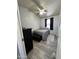 Secondary bedroom with ceiling fan, laminate floors, dresser, and ample natural light at 625 W Mckellips Rd # 358, Mesa, AZ 85201
