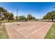 The community's basketball court is surrounded by trees and a green area for additional activities at 633 W Southern Ave # 1181, Tempe, AZ 85282