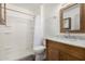 Well-lit bathroom featuring a new vanity, updated fixtures, and a walk-in shower with stylish shower curtain at 633 W Southern Ave # 1181, Tempe, AZ 85282