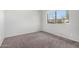 Simple bedroom with neutral carpeting, a bright window, and ample natural light at 633 W Southern Ave # 1181, Tempe, AZ 85282