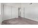 Bright bedroom with neutral carpeting and sliding door closet and doorway to other rooms at 633 W Southern Ave # 1181, Tempe, AZ 85282