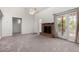 Open living room area featuring a fireplace, neutral tones, and plenty of natural light at 633 W Southern Ave # 1181, Tempe, AZ 85282