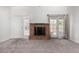 Spacious living room with a cozy brick fireplace and two access points at 633 W Southern Ave # 1181, Tempe, AZ 85282