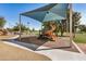 A colorful, shaded playground provides a safe and engaging space for children to play and socialize at 633 W Southern Ave # 1181, Tempe, AZ 85282