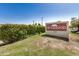 Community sign 'Mistwood 633' is surrounded by lush greenery in a well-maintained landscape at 633 W Southern Ave # 1181, Tempe, AZ 85282