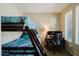 Bedroom with bunk beds, desk, and bright window offering natural light at 6605 N 93Rd Ave # 1035, Glendale, AZ 85305
