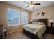 Comfortable bedroom with large windows offering natural light and neighborhood views at 6605 N 93Rd Ave # 1035, Glendale, AZ 85305