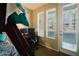 Bedroom featuring bunk beds, a work desk setup, and a door leading to a balcony at 6605 N 93Rd Ave # 1035, Glendale, AZ 85305