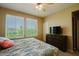 Inviting bedroom with natural light, large windows, and comfortable furnishings that offer a peaceful retreat at 6605 N 93Rd Ave # 1035, Glendale, AZ 85305