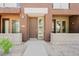 A closer view of the townhome's front entrance, showing the door, number, and landscaping at 6605 N 93Rd Ave # 1035, Glendale, AZ 85305