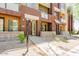 Townhome exterior with small yard, showing individual entrances and unit number at 6605 N 93Rd Ave # 1035, Glendale, AZ 85305