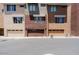 Exterior view of townhome garages. Each has a roll-up door, set in a row and well-maintained at 6605 N 93Rd Ave # 1035, Glendale, AZ 85305