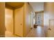 Hallway view with tile flooring, white walls, and doorways leading to different rooms at 6605 N 93Rd Ave # 1035, Glendale, AZ 85305