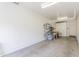 Spacious garage interior with hanging storage, bicycles, and a workbench at 706 E Washington St # 124, Phoenix, AZ 85034