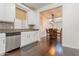 Bright kitchen offers stainless steel appliances, white cabinetry, and an open layout at 706 E Washington St # 124, Phoenix, AZ 85034