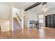 Bright open-concept living room with light hardwood floors, stairs, and modern furnishings at 706 E Washington St # 124, Phoenix, AZ 85034