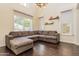 Bright living room with tall ceilings, abundant natural light, and modern chandelier at 706 E Washington St # 124, Phoenix, AZ 85034