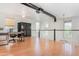 Second-floor loft space featuring hardwood floors, a ceiling fan, and built-in shelving at 706 E Washington St # 124, Phoenix, AZ 85034