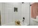 Clean bathroom featuring a white tiled shower, a sleek tub, and modern fixtures at 7428 E Cambridge Ave, Scottsdale, AZ 85257