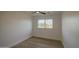 Empty bedroom featuring light wood floors, bright window light, and neutral walls at 7428 E Cambridge Ave, Scottsdale, AZ 85257