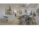 Open kitchen and dining area featuring an island, modern lighting, and seating at 7428 E Cambridge Ave, Scottsdale, AZ 85257