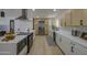 Well-equipped kitchen with modern appliances, quartz countertops, and ample cabinet space at 7428 E Cambridge Ave, Scottsdale, AZ 85257