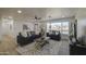 Bright living room featuring two blue sofas, hardwood floors, and a large window at 7428 E Cambridge Ave, Scottsdale, AZ 85257