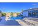 Backyard pool with surrounding concrete deck and desert landscaping for low maintenance and relaxation at 7428 E Cambridge Ave, Scottsdale, AZ 85257