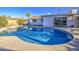 Sparkling pool and backyard oasis featuring a modern home exterior and beautiful blue water at 7428 E Cambridge Ave, Scottsdale, AZ 85257