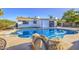 Backyard pool with desert landscaping and a covered patio area, perfect for outdoor entertaining at 7428 E Cambridge Ave, Scottsdale, AZ 85257