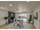 Inviting seating area with a brick fireplace, mirror, and sliding door access to backyard at 7428 E Cambridge Ave, Scottsdale, AZ 85257