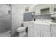 Updated bathroom featuring shower and modern sink and vanity at 7731 E Rose Ln, Scottsdale, AZ 85250