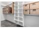 Well-organized closet with built-in shelves and Banker Boxes for optimal storage solutions at 7731 E Rose Ln, Scottsdale, AZ 85250