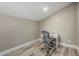 Modern office with desk, chair, and wood look flooring at 7731 E Rose Ln, Scottsdale, AZ 85250