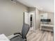 Modern office with desk, chair, and wood look flooring at 7731 E Rose Ln, Scottsdale, AZ 85250