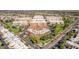An aerial view of a condo complex surrounded by lush landscaping, mature trees, and a neighboring street at 7910 E Camelback Rd # 302, Scottsdale, AZ 85251