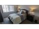 Bright bedroom with a queen-size bed, matching nightstands, and a large window at 7910 E Camelback Rd # 302, Scottsdale, AZ 85251
