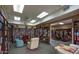 Explore the extensive library, featuring rows of books, comfortable seating, and inviting atmosphere for reading and learning at 7910 E Camelback Rd # 302, Scottsdale, AZ 85251