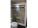 Bathroom featuring a tile shower with glass doors and a built-in seat at 7910 E Camelback Rd # 302, Scottsdale, AZ 85251