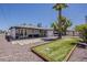 Expansive backyard featuring a covered patio with stylish seating and a fun bocce ball court for outdoor enjoyment at 8137 E Indian School Rd, Scottsdale, AZ 85251