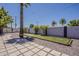 Enjoy outdoor living in this backyard featuring a putting green, desert landscaping, and a relaxing hammock at 8137 E Indian School Rd, Scottsdale, AZ 85251