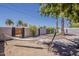 Serene backyard featuring a comfortable hammock, desert landscaping, and mature trees for a tranquil outdoor retreat at 8137 E Indian School Rd, Scottsdale, AZ 85251